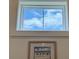 Bright, airy window offers serene sky views over framed artwork at 305 Matilda St, Edisto Beach, SC 29438