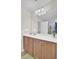 Bathroom boasts a white countertop, warm wood cabinets, and is brightly lit with an adjacent shower at 308 Legendres Dr, Goose Creek, SC 29445