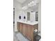 Bathroom featuring a double sink vanity, large mirror, and modern lighting at 308 Legendres Dr, Goose Creek, SC 29445