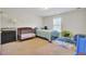 Inviting Bedroom with a crib, single bed, and bright rug, perfect for little ones at 308 Legendres Dr, Goose Creek, SC 29445