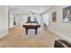 Expansive game room showcasing a billiard table with movie posters, two windows, and neutral carpet at 308 Legendres Dr, Goose Creek, SC 29445