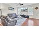 Comfortable living room featuring hardwood floors, leather furniture, and a ceiling fan at 308 Legendres Dr, Goose Creek, SC 29445