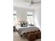 Bright bedroom featuring a stylish bed with striped blanket and modern decor elements at 3139 Vanessa Lynne Ln, Johns Island, SC 29455