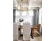 Bright dining room features a wooden table, upholstered chairs, and a stylish light fixture at 3139 Vanessa Lynne Ln, Johns Island, SC 29455