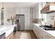 Well-equipped kitchen with stainless steel refrigerator, gray cabinets, and a modern island sink at 3139 Vanessa Lynne Ln, Johns Island, SC 29455