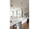 Bright kitchen with a large island, farmhouse sink, and stainless steel appliances that opens to living space at 3139 Vanessa Lynne Ln, Johns Island, SC 29455