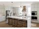 Bright kitchen with large island, bar seating, and stainless appliances with ample counter space and gray cabinetry at 3139 Vanessa Lynne Ln, Johns Island, SC 29455