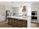 Bright kitchen with a large island, bar stool seating, gray cabinetry, and stainless steel appliances at 3139 Vanessa Lynne Ln, Johns Island, SC 29455
