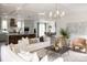 Open-concept living area with a kitchen, dining area, and modern furnishings and decor at 3139 Vanessa Lynne Ln, Johns Island, SC 29455