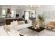 Bright living room boasts an open floor plan, modern décor, and seamless flow into the kitchen and dining areas at 3139 Vanessa Lynne Ln, Johns Island, SC 29455