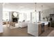 Open-concept living space with a fireplace, modern furnishings, and an island with bar seating at 3139 Vanessa Lynne Ln, Johns Island, SC 29455
