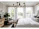Bright primary bedroom featuring large windows with a view, light-colored walls, and warm decor at 3139 Vanessa Lynne Ln, Johns Island, SC 29455