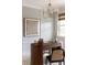 Inviting home office featuring an elegant wood desk, chandelier, and refined artwork at 3139 Vanessa Lynne Ln, Johns Island, SC 29455