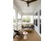 Covered front porch with a ceiling fan, comfortable seating, and scenic views of the neighborhood at 3139 Vanessa Lynne Ln, Johns Island, SC 29455