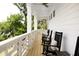 Charming front porch with rocking chairs and wooden flooring, offering relaxing outdoor space at 3139 Vanessa Lynne Ln, Johns Island, SC 29455