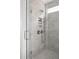 Modern bathroom glass enclosed shower featuring gray brick style tiles, with dual shower heads, and a built in niche at 3139 Vanessa Lynne Ln, Johns Island, SC 29455