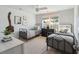 Bedroom featuring a ceiling fan, patterned wallpaper accent wall, and twin beds at 3143 Vanessa Lynne Ln, Johns Island, SC 29455