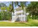 Beautiful two-story home with double porches, classic design, and lush, green landscaping at 3143 Vanessa Lynne Ln, Johns Island, SC 29455