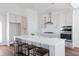 A spacious kitchen featuring white countertops, shaker cabinets, and seating at the island at 3143 Vanessa Lynne Ln, Johns Island, SC 29455