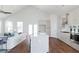 Bright, open-concept space featuring a modern kitchen and a comfortable living area with hardwood floors at 3143 Vanessa Lynne Ln, Johns Island, SC 29455