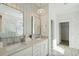 Elegant main bathroom featuring double vanity, bright lighting, and walk in closet at 3143 Vanessa Lynne Ln, Johns Island, SC 29455