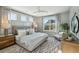 Stylish main bedroom featuring board and batten accents, and large windows, and a cozy rug at 3143 Vanessa Lynne Ln, Johns Island, SC 29455