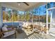 Covered screened porch offering an outdoor space for relaxing and entertaining at 3143 Vanessa Lynne Ln, Johns Island, SC 29455