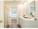 Bright bathroom featuring double sinks, lots of counter space, and a large mirror at 317 Salvia Sq, Moncks Corner, SC 29461