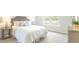 Cozy bedroom featuring a comfortable bed, lots of pillows, and a view to the backyard at 317 Salvia Sq, Moncks Corner, SC 29461