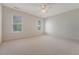 Spacious bedroom with neutral carpet, ceiling fan, and well-lit windows at 3331 Cottonfield Dr, Mount Pleasant, SC 29466