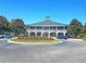 Beautiful clubhouse with brick facade, circular drive and manicured landscaping at 3331 Cottonfield Dr, Mount Pleasant, SC 29466