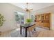 Bright dining room with wood table, chairs, and sliding glass door with outdoor access at 3331 Cottonfield Dr, Mount Pleasant, SC 29466