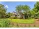 Beautiful brick home with well-manicured lawn and mature trees at 3331 Cottonfield Dr, Mount Pleasant, SC 29466