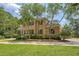 Traditional two-story brick home with black shutters and inviting curb appeal at 3331 Cottonfield Dr, Mount Pleasant, SC 29466