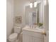 Cozy half bathroom with white sink, vanity, gold fixtures, and decorative details at 3331 Cottonfield Dr, Mount Pleasant, SC 29466