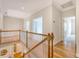 Upstairs hallway with wood flooring, views to below, and entryways to various rooms at 3331 Cottonfield Dr, Mount Pleasant, SC 29466