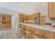 Spacious kitchen with wooden cabinets, stainless steel appliances, granite countertop, and barstool seating at 3331 Cottonfield Dr, Mount Pleasant, SC 29466
