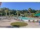 Community pool area featuring lounge chairs, slides, and tropical landscaping at 3331 Cottonfield Dr, Mount Pleasant, SC 29466