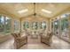 Bright sunroom with wood ceiling, many windows, and comfortable seating, perfect for relaxation at 3331 Cottonfield Dr, Mount Pleasant, SC 29466