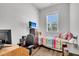 Cozy bedroom with hardwood floors, window, workspace, and colorful accents at 3529 Habenaria Rd # 33, Mount Pleasant, SC 29466