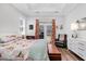 Cozy bedroom with tray ceilings, hardwood floors, and a private outdoor access at 3529 Habenaria Rd # 33, Mount Pleasant, SC 29466