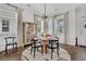 Charming dining room featuring a round table, designer light fixture, and hardwood floors at 3529 Habenaria Rd # 33, Mount Pleasant, SC 29466