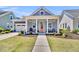 Charming single-story home with a welcoming front porch, beautiful landscaping, and a nicely paved walkway at 3529 Habenaria Rd # 33, Mount Pleasant, SC 29466