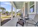 A relaxing front porch features comfortable seating and a tranquil view of the neighborhood street at 3529 Habenaria Rd # 33, Mount Pleasant, SC 29466
