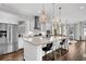 Bright kitchen featuring a large island with seating, granite countertops, and stainless steel appliances at 3529 Habenaria Rd # 33, Mount Pleasant, SC 29466