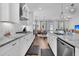 Well-equipped kitchen with white cabinets, granite countertops, and stainless steel appliances at 3529 Habenaria Rd # 33, Mount Pleasant, SC 29466