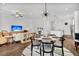 Open-concept living and dining area with hardwood floors and abundant natural light at 3529 Habenaria Rd # 33, Mount Pleasant, SC 29466