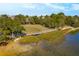 Scenic aerial view of the community with a wooden walking bridge and marsh views at 405 Spartina Ln # 405, Charleston, SC 29492