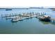 Expansive aerial view of a marina with many boats docked in the clear blue water at 405 Spartina Ln # 405, Charleston, SC 29492