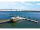 Scenic aerial view of bridge and pier on the calm waterway, capturing the essence of waterfront living at 405 Spartina Ln # 405, Charleston, SC 29492